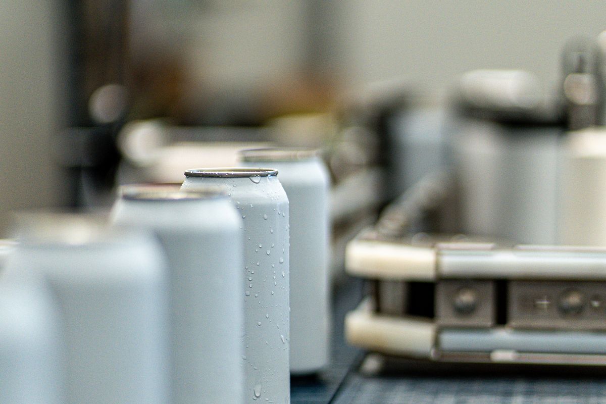 Beverage cans on a filling line conveyor