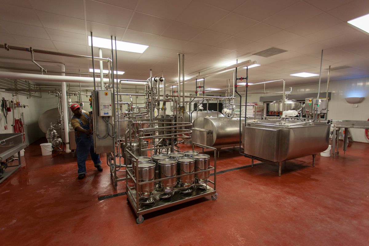 Stainless steel milk processing equipment in a dairy plant