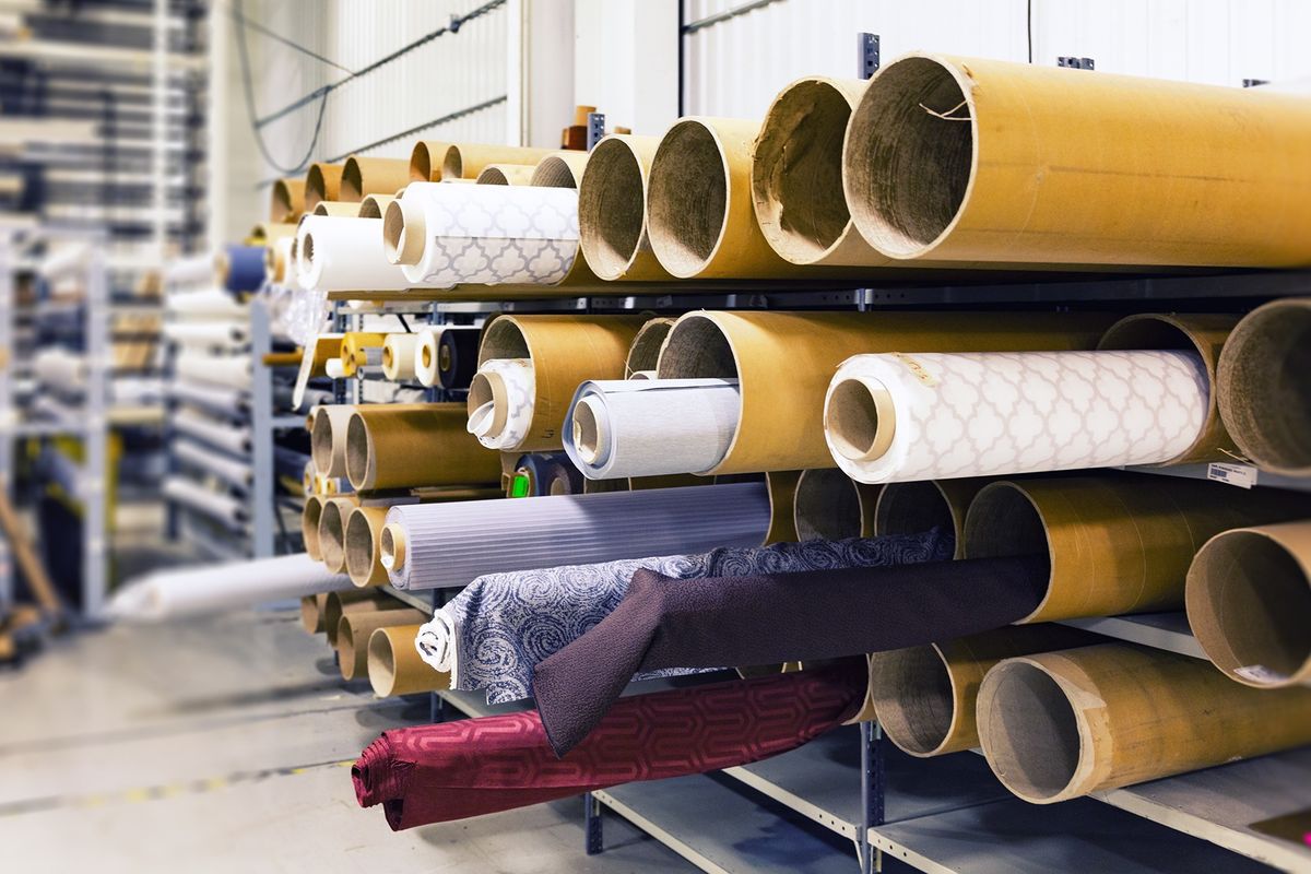 Rolls of colorful dyed textile fabric